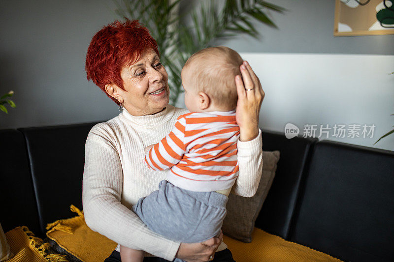 Grandmother and her grandchild. Multi generation family photo.